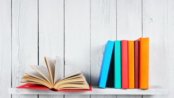 brightly coloured books on a shelf